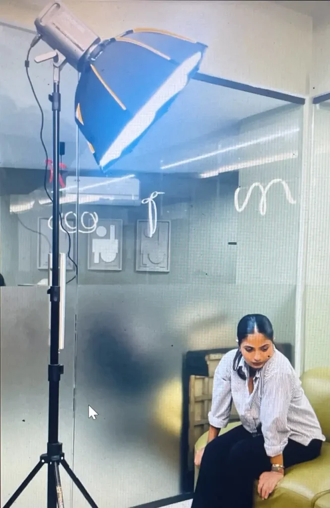 Freelance digital marketing strategist in Ernakulam preparing for a professional video presentation with studio lighting.